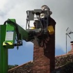 Removal from chimney, using a cherry-picker